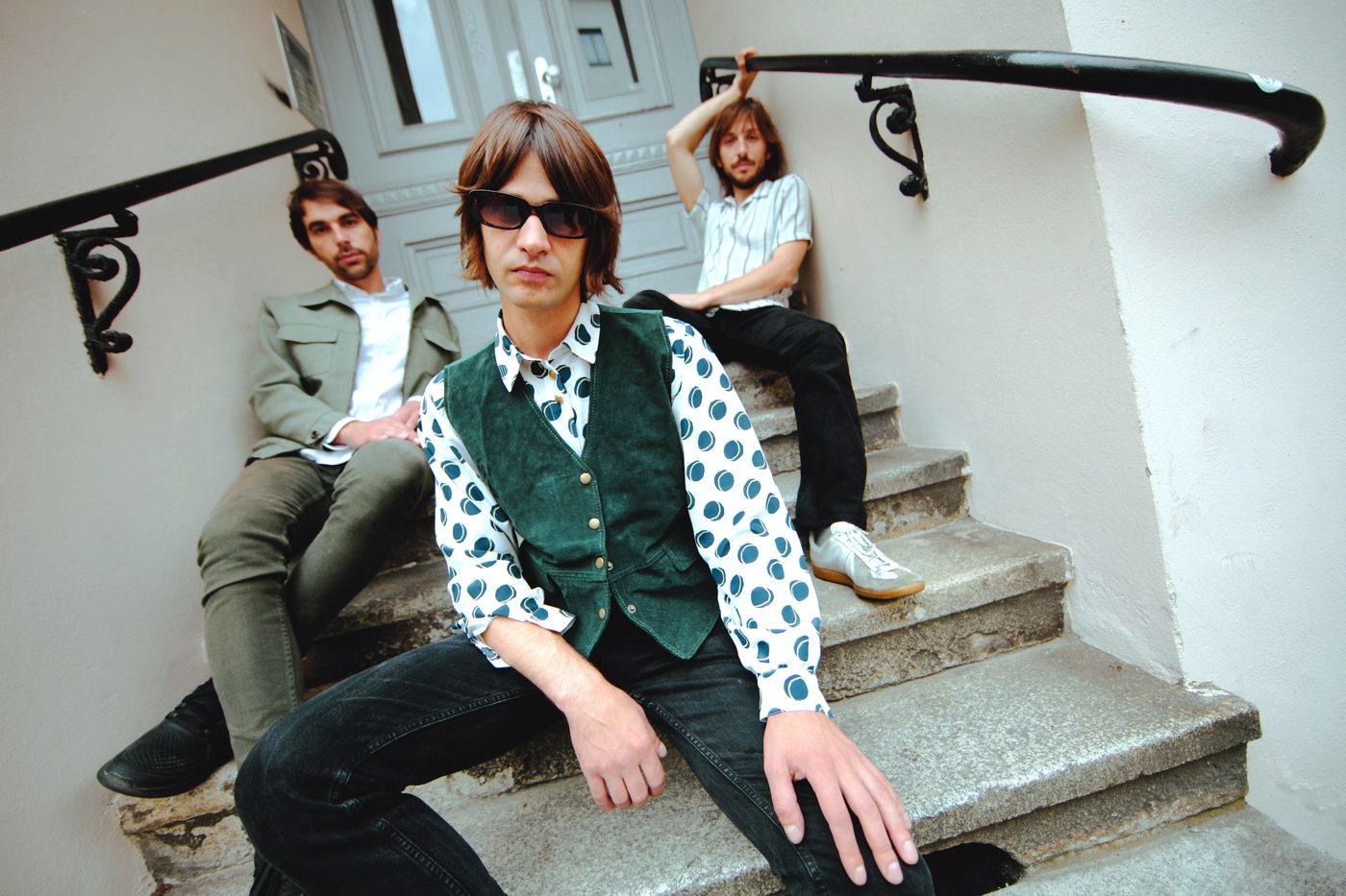 Love'n'Joy band members sitting on a staircase