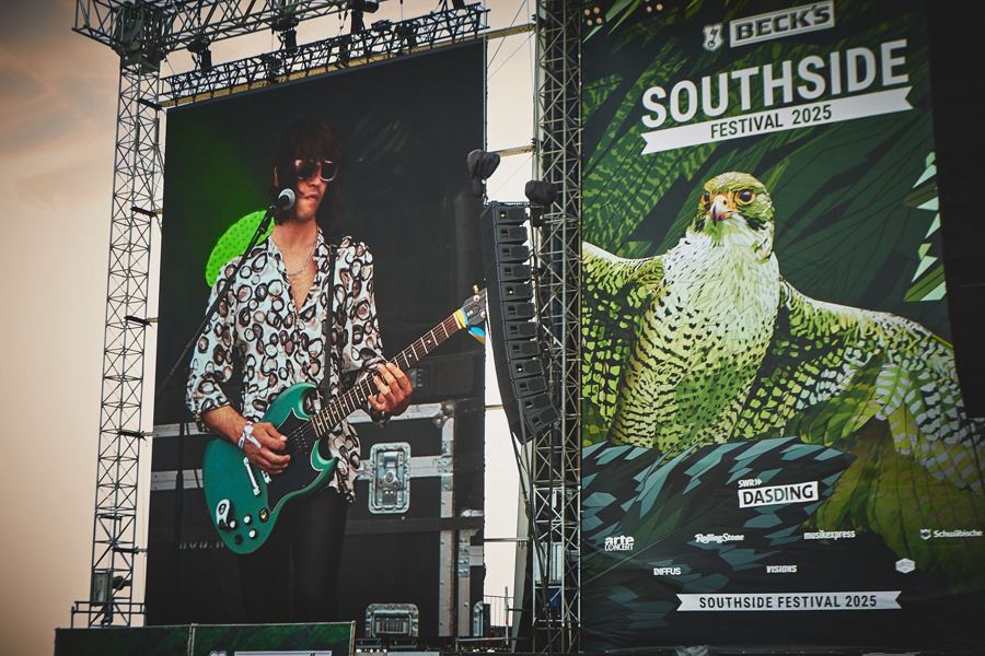 Guitarist on the big screen next to the Southside Festival 2025 banner